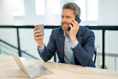 Photo for Business man working in office. Businessman in casual suit using laptop in office. Business man office worker in formal suit. Office manager talk phone. Ceo businessman using smartphone - Royalty Free Image