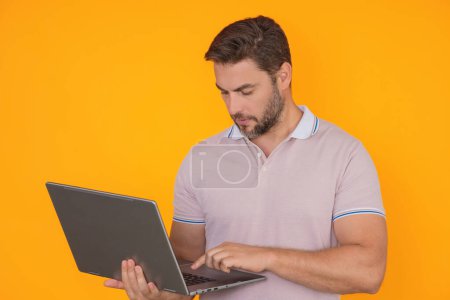 Photo for Business man using laptop. Male businessman worker watch video on computer laptop. Serious man hold laptop computer. Caucasian male worker in glasses work with laptop, studio isolated portrait - Royalty Free Image