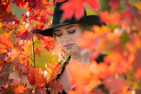 Photo for Portrait of young woman with autumn leafs. Romantic girl dream, hold fall maple leaves. Autumnal season - Royalty Free Image