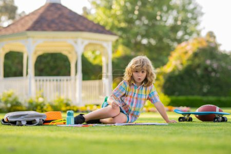 Photo for Summer leisure with children. School kid drawing in summer park, painting art. Little painter draw pictures outdoor. Happy child playing outside. Drawing summer theme - Royalty Free Image