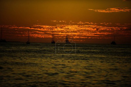 Photo for Sunrise in the sea with soft wave and cloudy. Sunset over sea with golden dramatic sky panorama. Calm sea with sunset sky. Ocean and sky background - Royalty Free Image