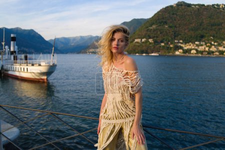 Photo for Woman near on Lake Como, Italy. Girl in a sexy dress. Italian summer vacation - Royalty Free Image