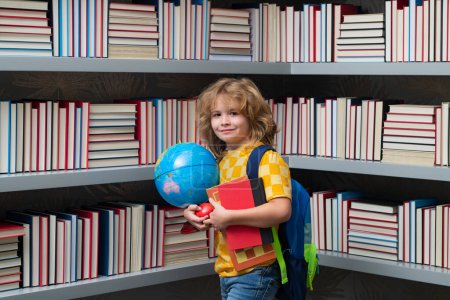 Photo for School boy with world globe and books. School kid student learning, study language or literature at school. Elementary school child. Portrait of nerd pupil studying - Royalty Free Image