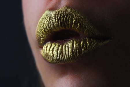 Photo for Sexy gold lips, golden lipgloss on sexy lips, metallic mouth. Sensual woman mouth. Sexy girl golden lips, gold mouth. Glowing gold skin and gild lips. Metallic shine golden lip gloss - Royalty Free Image