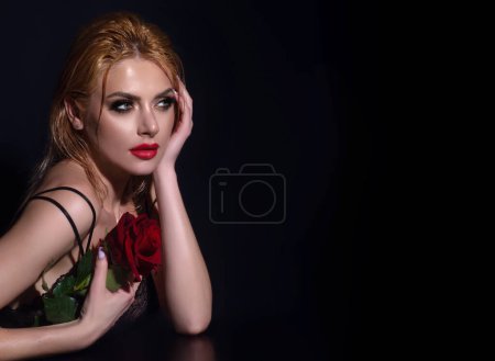 Photo for Sexy woman with red rose. Pretty woman, with red lips, and fashion makeup with roses posing in studio. Beauty and fashion portrait - Royalty Free Image