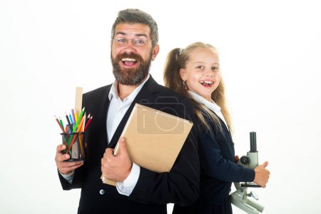 Photo for Portrait of funny pupil schoolgirl and tutor with school supplies. Happy teacher and school girl isolated on white background. Back to school - Royalty Free Image