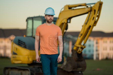 Photo for Builder man at building site. Construction manager in helmet. Male construction engineer. Architect at a construction site. Handyman builder in hardhat. Building concept. Builder foreman - Royalty Free Image