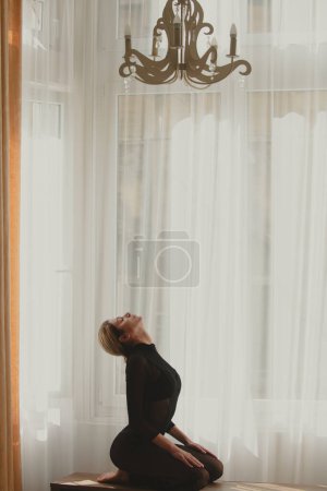 Photo for Yoga woman stretching with pose stretch. Fit fitness athlete girl exercising sports stretches - Royalty Free Image