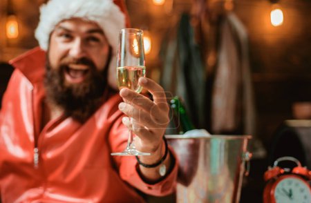 Photo for Handsome Christmas Santa Claus. Happy people partying with champagne. Merry christmas and Happy new year. Wish you merry christmas - Royalty Free Image