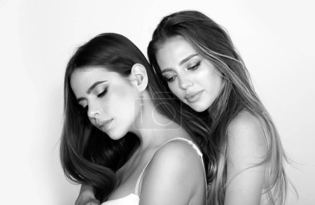 Photo for Portrait of two cheerful young women. Two beautiful young women with perfect skin in the studio. Lgbt, tolerance, lesbians couple love concept - Royalty Free Image