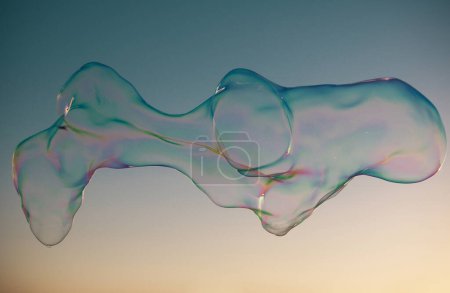 Photo for Huge bubbles. Blowing big soap bubbles in the air. Freedom, summer concepts - Royalty Free Image