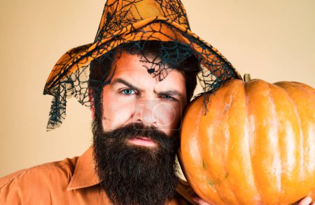 Photo for Happy Halloween Stickers. Smiling happy man with pumpkin. Halloween Man posing with pumpkins. Thanksgiving seasonal cooking ingredients - Royalty Free Image