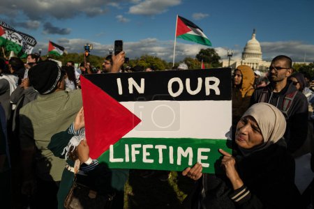 Photo for Washington DC, USA - October 21, 2023: Pro-Palestine, anti-Israel protesters. Israel and Hamas in the Gaza Strip. War between Israel and Palestine. Stop Genocide Sign at Palestine Protest - Royalty Free Image