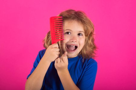 Photo for Tangled kids hair. Little child boy combing hair, isolated background - Royalty Free Image