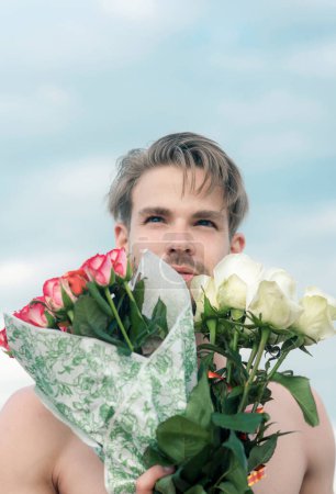 Photo for Romantic man with rose bouquet. valentines day present. gift with love. ready for date. muscular macho man with flowers. Love you more than yesterday. man in love. birthday present. party celebration. - Royalty Free Image