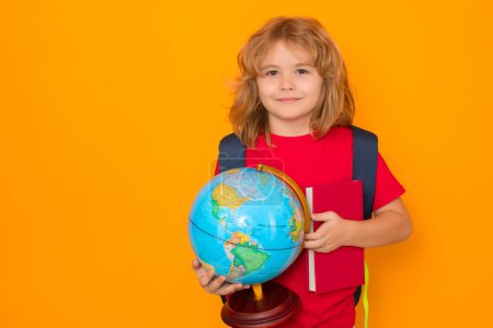 Photo for Knowledge day. School boy with world globe and book. Kid boy from elementary school. Little student, smart nerd pupil ready to study. Concept of knowledge, education and learning. - Royalty Free Image