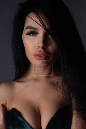 Photo for Beautiful portrait young brunette woman. Beautiful model posing in studio. Portrait of beautiful girl. Woman sensual face close up. Pretty beautiful girl portrait on studio background. Sensual look - Royalty Free Image