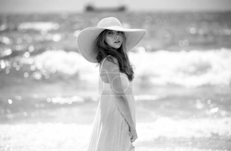 Photo for Fashion model posing on the beach. Summer dress fashionable woman clothes. Young beautiful hipster woman on tropical vacation, summer trend style - Royalty Free Image
