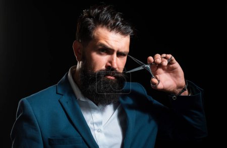 Photo for Bearded man, portrait of man with long beard and moustache. Barber scissors for barber shop. Vintage barbershop, shaving. Brutal serious male with modern hairstyle on black - Royalty Free Image