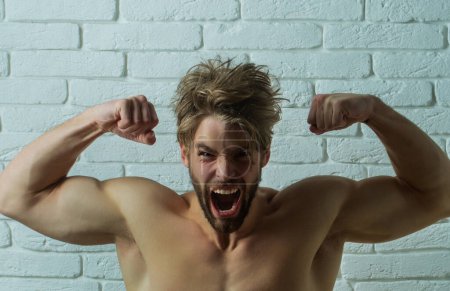 Photo for Strong Muscular guy. Power man body. Muscles body. Angry man. Aggressive expression. Screaming, Hate and Rage. Emotional Man Screaming. Emotional Face. Portrait of young Angry Man - Royalty Free Image