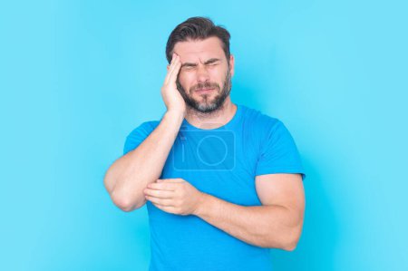 Photo for Man suffering from headache. Tired, headache and eye strain. Man with stress, burnout and fatigue eyestrain. Vision problem, bad sight. Headache pain and migraine. Man with headache hold hands on head - Royalty Free Image