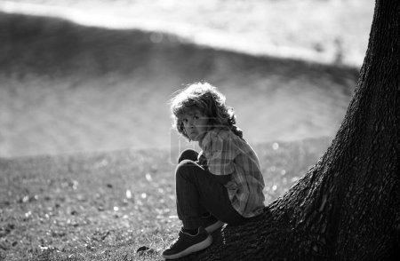 Photo for Child abuse concept. Lonely depressed kid. Loneliness boy. Human depression, problems. Kids emotions. Negative nervous breakdown - Royalty Free Image