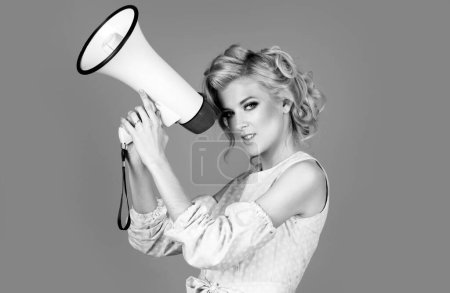 Photo for Woman pinup screaming in megaphone isolated on background studio portrait. Shout girl speaks in a loudspeaker megaphone - Royalty Free Image