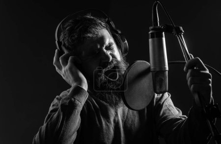 Photo for Man with microphone singing song. Musician in music hall. Funny guy singing in karaoke - Royalty Free Image