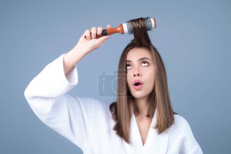 Photo for Young woman taking care with hair comb of her hair. Haircare. Pretty girl brushing hairs with comb. Beauty, hair loss products, shampoo and hair care concept - Royalty Free Image