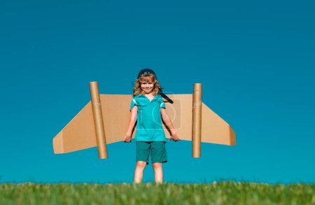 Photo for Kid with jet pack superhero. Child pilot against summer sky background. Success, leader and winner concept. Imagination, kids freedom - Royalty Free Image