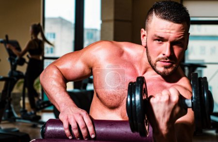 Photo for Muscular man doing crossfit. Man training with dumbbells. Dumbbell. Muscular guy exercises with dumbbells. Strong bodybuilder. Muscles with dumbbell - Royalty Free Image