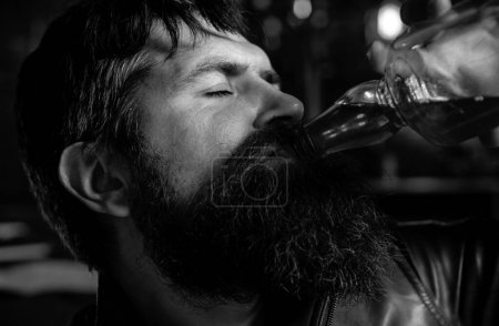 Photo for Man with beard holds glass brandy. Man holding a glass of whisky. Sipping whiskey. Degustation, tasting. Barbershop. Shaving - Royalty Free Image