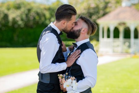 Photo for Gay kiss on wedding. marriage gay couple tender kissing. close up portrait of gay kissed. Homosexual gay couple, LBGT couple at wedding ceremony, LGBTQ - Royalty Free Image