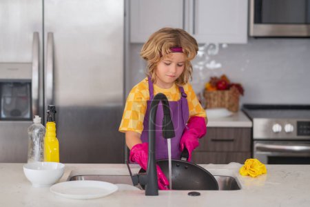Photo for American kid learning domestic chores at home. Kid cleaning to help parents with housework routine. Schoolboy housekeeping - Royalty Free Image