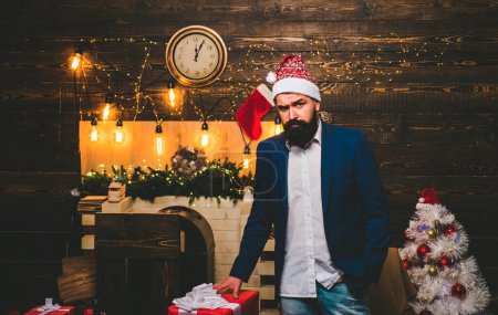Photo for Christmas Celebration holiday. Santa businessman in business suit. Christmas man in fashion red dress hold gift. Gift emotions. Party Christmas. Hipster Santa claus - Royalty Free Image