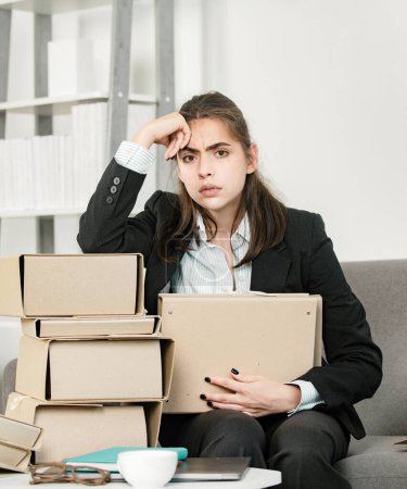 Photo for Upset business woman with many folders of documents, unhappy secretary girl working overtime at office. Problem solution - Royalty Free Image