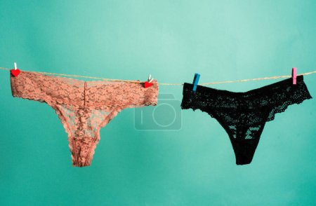 Foto de Bragas de encaje. La lencería sexy aislada en el fondo azul. Bikini tanga bragas ropa interior lencería - Imagen libre de derechos