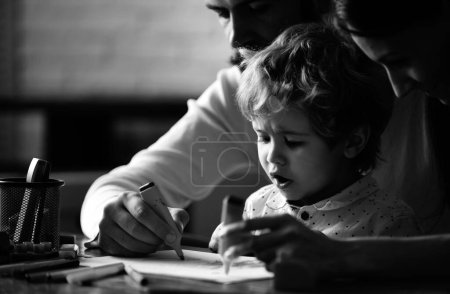 Photo for Happy family portrait having fun together. Kids early arts and crafts education, drawing. Father mother and child son drawing at home. Early childhood education, kids creative growth - Royalty Free Image