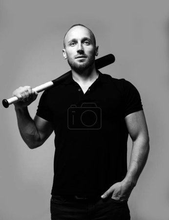 Photo for Brutal man, serious face of handsome male model, concept of men power and strong. Guy with baseball bat for fighting. Dangerous man with serious emotion - Royalty Free Image