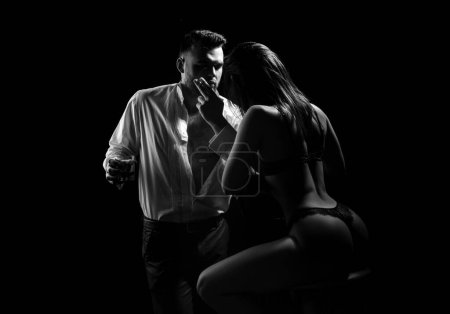 Photo for Rich man whispering young lover in underwear, sensuality and desire. Lingerie black - Royalty Free Image