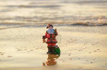 Photo for New year decorations. Summer Santa on sand. Holiday concept for Christmas - Royalty Free Image