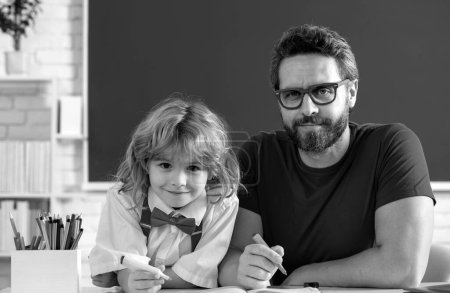 Photo for Tutor and child learning at school classroom. Teacher and little student portrait, teachers day - Royalty Free Image