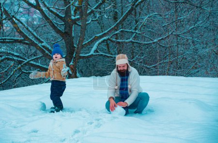 Photo for Happy father and son play on winter Christmas time - Royalty Free Image