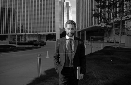 Photo for Businessman with success business. Outdoors portrait male model in suit - Royalty Free Image