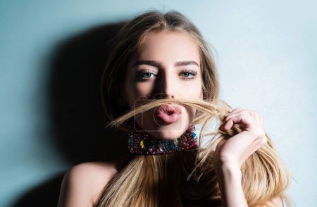 Photo for Funny girl making moustache with her hair. Beauty girl, beautiful blonde women hair. Glamour lady with long hair Portrait of beautiful seductive woman - Royalty Free Image
