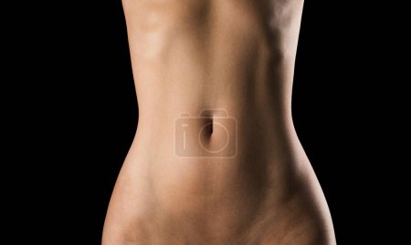 Foto de Fondo de textura corporal desnuda para banner. Vientre femenino desnudo. Salud de la mujer. Ginecología, íntima. Tratamiento del útero, fertilidad femenina - Imagen libre de derechos