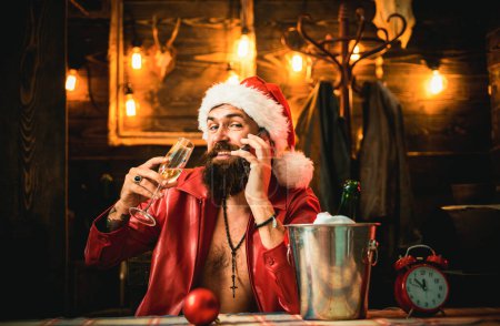 Photo for New Year drinking. Boys, were better off drinking today. You need a decent drink on New Year. Drank Santa. Santa drink champagne. New year champagne - Royalty Free Image