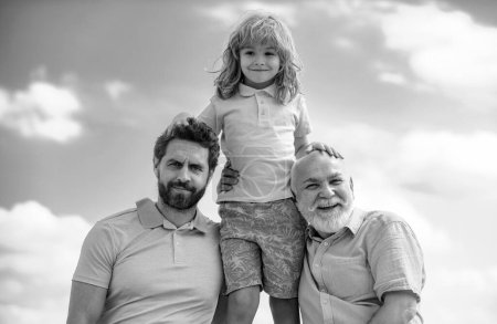 Photo for Portrait of grandfather father and funny son child outdoor on sky. Fathers day. Men in different ages. Multi generation family - Royalty Free Image