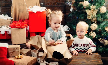 Photo for Christmas kids - happiness concept. Christmas children. Babies. Merry Christmas. Happy child with christmas gift box - Royalty Free Image