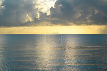 Photo for Sunset on sea background. Nature wallpaper with summer sea. Water sea texture. Calm sunrise on tropical sea. Idyllic ocean, peaceful heaven - Royalty Free Image